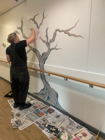 Amy Edisbury-Williams at work on a hospital mural.jpg